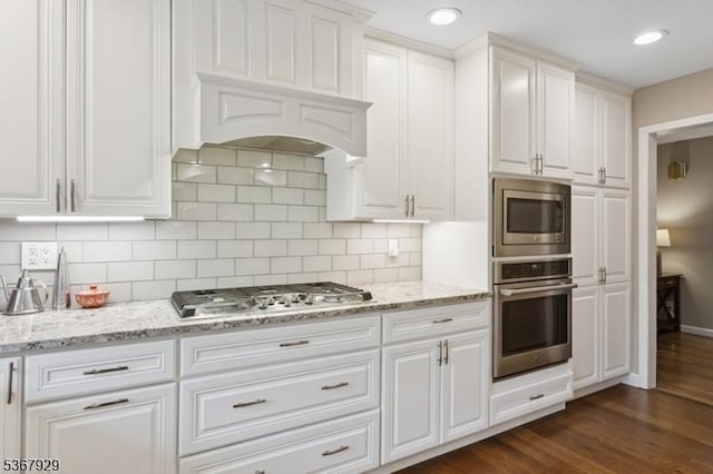 11 Old Farm Rd, North Caldwell Boro, NJ 07006 - kitchen featuring stainless steel appliances, white cabinetry, backsplash, dark wood-type flooring, and light stone countertops