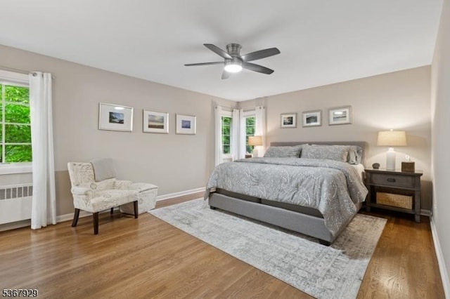 11 Old Farm Rd, North Caldwell Boro, NJ 07006 - bedroom featuring radiator heating unit, multiple windows, wood finished floors, and ceiling fan
