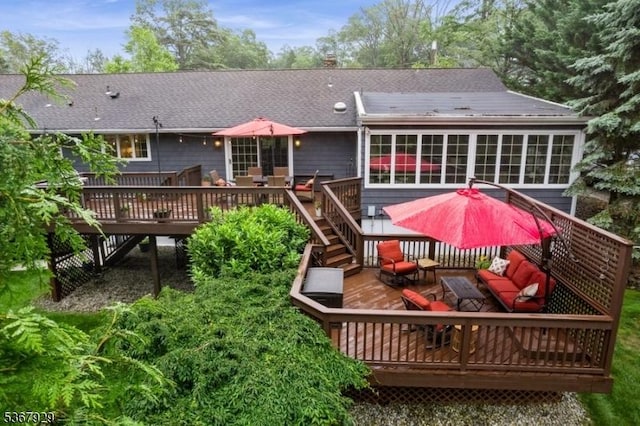 11 Old Farm Rd, North Caldwell Boro, NJ 07006 - rear view of property featuring a wooden deck, roof with shingles, a sunroom, and an outdoor living space