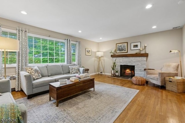 11 Old Farm Rd, North Caldwell Boro, NJ 07006 - living room featuring wood finished floors, a stone fireplace, and recessed lighting