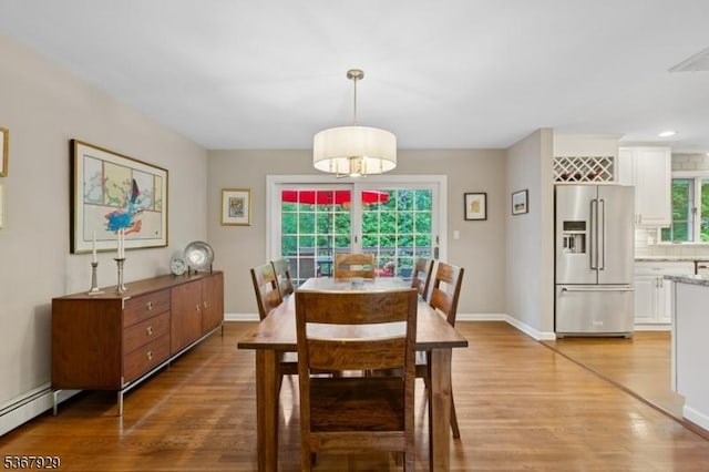 11 Old Farm Rd, North Caldwell Boro, NJ 07006 - dining area featuring light wood-style floors and a baseboard heating unit