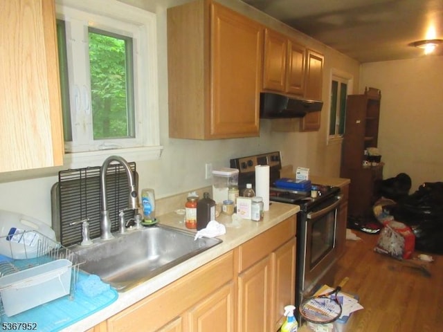 436 Diamond Spring Rd, Denville Twp, NJ 07834 - kitchen with electric stove, under cabinet range hood, light countertops, and wood finished floors