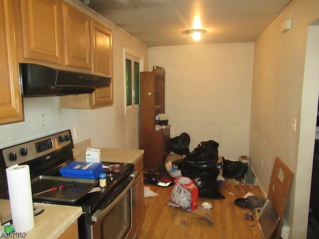 436 Diamond Spring Rd, Denville Twp, NJ 07834 - kitchen with electric range, under cabinet range hood, wood finished floors, and light countertops