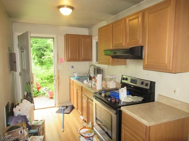 436 Diamond Spring Rd, Denville Twp, NJ 07834 - kitchen with stainless steel range with electric cooktop, range hood, light wood-style flooring, and light countertops
