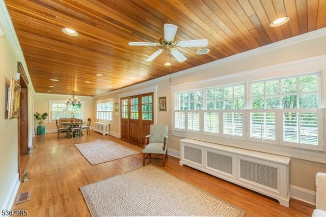 137 Boulevard, Mountain Lakes Boro, NJ 07046 - sunroom / solarium featuring radiator heating unit and a chandelier