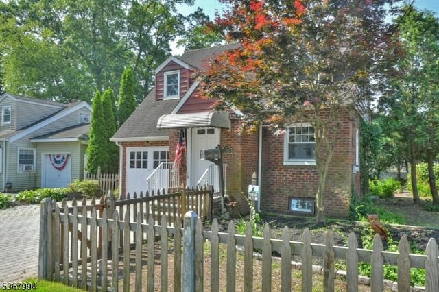 36 Grove St, Waldwick Boro, NJ 07463 - view of front of home with brick siding, driveway, and roof with shingles
