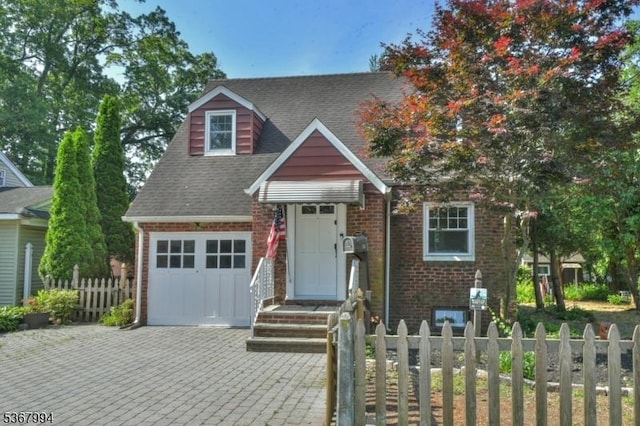 36 Grove St, Waldwick Boro, NJ 07463 - view of front of home with brick siding, a shingled roof, driveway, and a garage