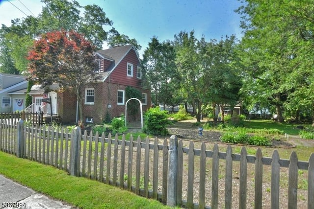 36 Grove St, Waldwick Boro, NJ 07463 - view of front facade featuring brick siding and a fenced front yard