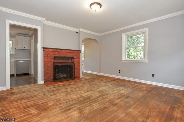 36 Grove St, Waldwick Boro, NJ 07463 - unfurnished living room with wood finished floors, arched walkways, ornamental molding, and a fireplace