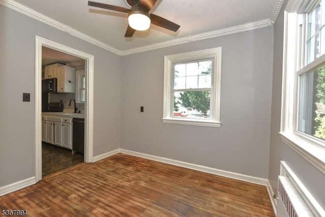 36 Grove St, Waldwick Boro, NJ 07463 - unfurnished room with ceiling fan, radiator heating unit, plenty of natural light, crown molding, and dark wood-type flooring