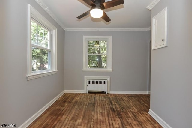 36 Grove St, Waldwick Boro, NJ 07463 - spare room with radiator, dark wood-style floors, ceiling fan, and crown molding