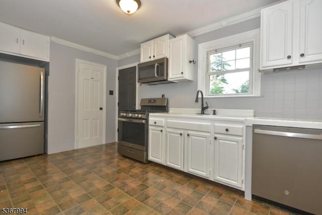 36 Grove St, Waldwick Boro, NJ 07463 - kitchen featuring appliances with stainless steel finishes, light countertops, white cabinetry, stone finish flooring, and backsplash