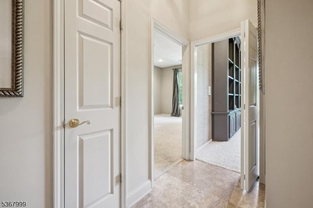 1407 Four Seasons Dr Unit 1407, Wayne Twp, NJ 07470 - hallway featuring light carpet and baseboards