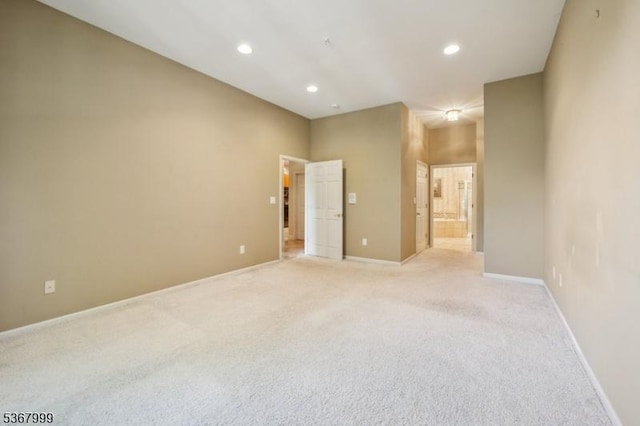 1407 Four Seasons Dr Unit 1407, Wayne Twp, NJ 07470 - empty room featuring light carpet and recessed lighting