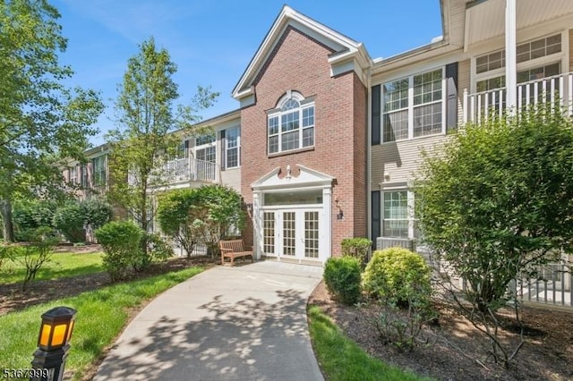1407 Four Seasons Dr Unit 1407, Wayne Twp, NJ 07470 - view of property with french doors and brick siding