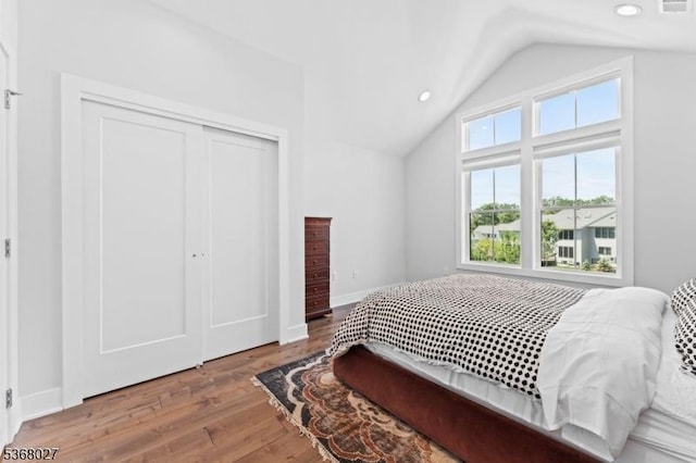 28 Peacock Ln Unit 28, Berkeley Heights Twp, NJ 07922 - bedroom with lofted ceiling, multiple windows, wood finished floors, a closet, and recessed lighting