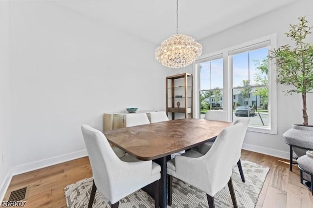 28 Peacock Ln Unit 28, Berkeley Heights Twp, NJ 07922 - dining space with a chandelier and wood finished floors