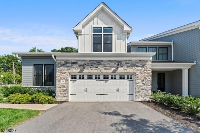 28 Peacock Ln Unit 28, Berkeley Heights Twp, NJ 07922 - view of front of home with stone siding, driveway, a garage, and board and batten siding
