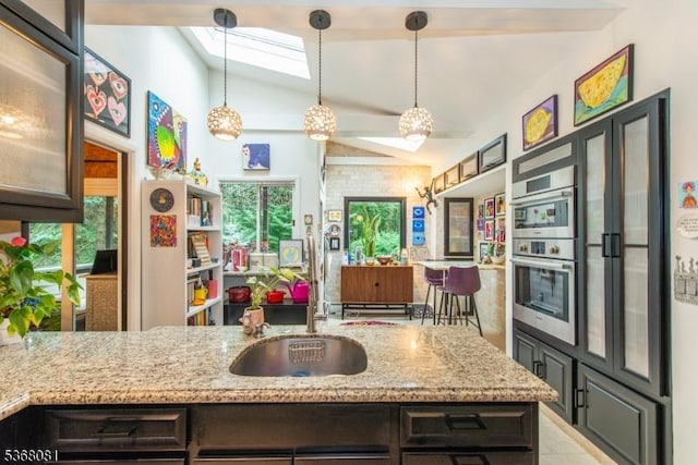 7 Deer Ct, Chester Twp, NJ 07930 - kitchen with lofted ceiling, double oven, healthy amount of natural light, a skylight, and light stone countertops