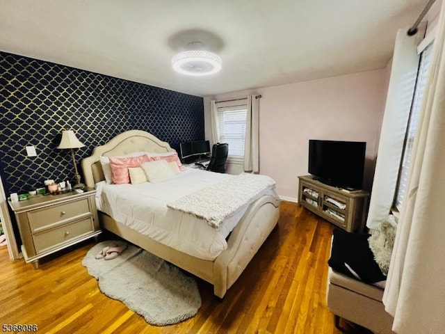 185 High St, Metuchen Boro, NJ 08840 - bedroom with wood finished floors and an accent wall