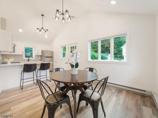 8 Blanche Dr, Jefferson Twp, NJ 07849 - dining space with lofted ceiling, a baseboard radiator, plenty of natural light, light wood-type flooring, and recessed lighting