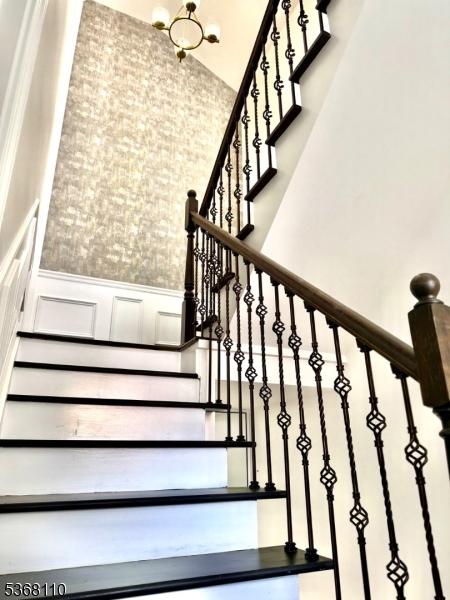 109 Fulton St, Elizabeth City, NJ 07206 - stairway with wainscoting and a decorative wall