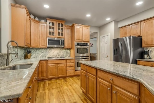 40 Primrose Ln, Sparta Twp, NJ 07871 - kitchen featuring appliances with stainless steel finishes, light wood-type flooring, light stone countertops, tasteful backsplash, and recessed lighting