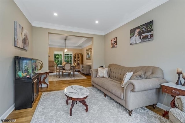 40 Primrose Ln, Sparta Twp, NJ 07871 - living area featuring light wood-style floors, crown molding, arched walkways, and recessed lighting