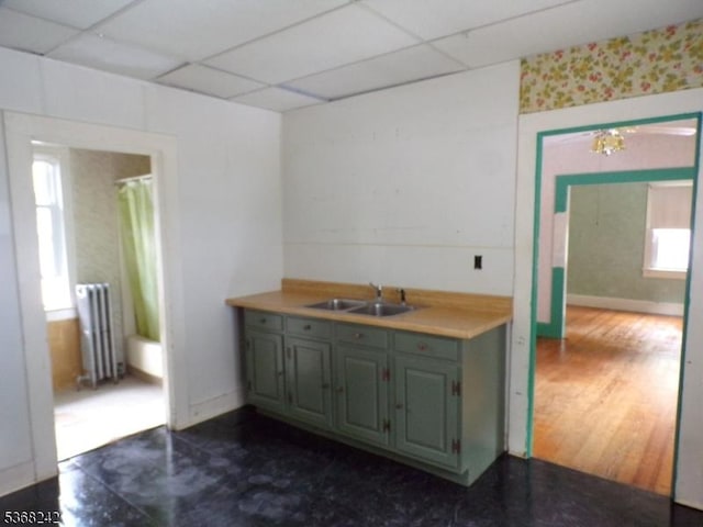 190 Market St, Belvidere Twp, NJ 07823 - kitchen with radiator, a drop ceiling, dark wood-type flooring, and wallpapered walls
