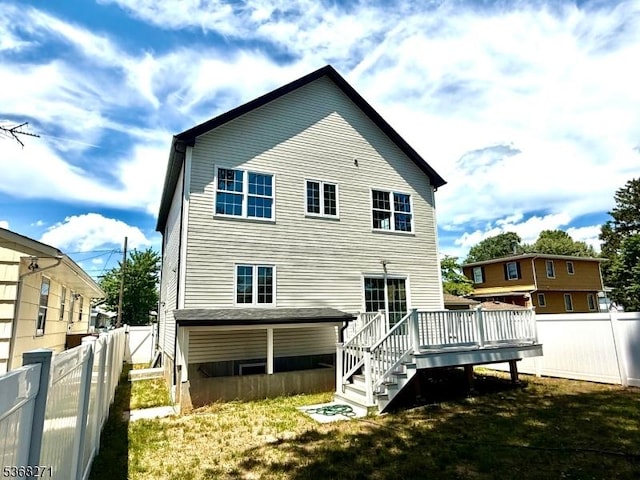 47 Bird Ave, Woodbridge Twp, NJ 08830 - rear view of property featuring a deck and a fenced backyard