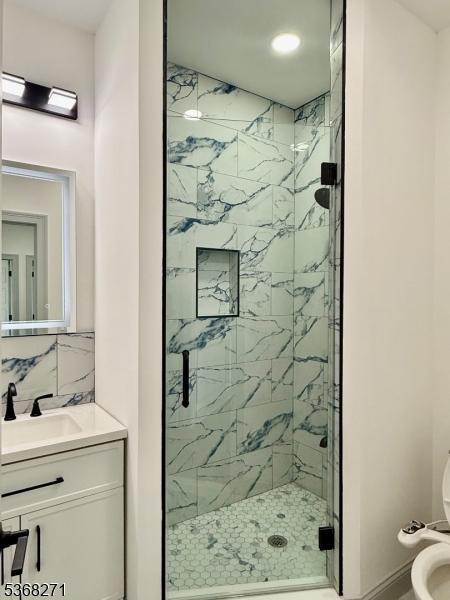 47 Bird Ave, Woodbridge Twp, NJ 08830 - bathroom with a marble finish shower and vanity