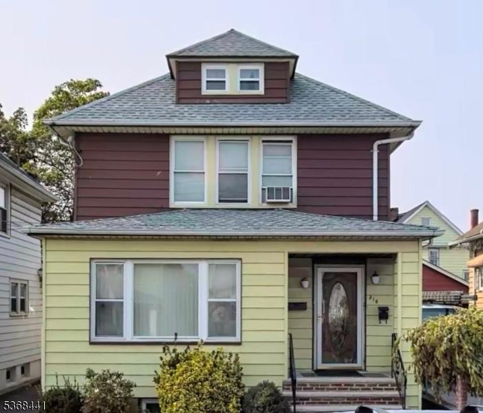 318 E 19th St, Paterson City, NJ 07524 - american foursquare style home featuring roof with shingles