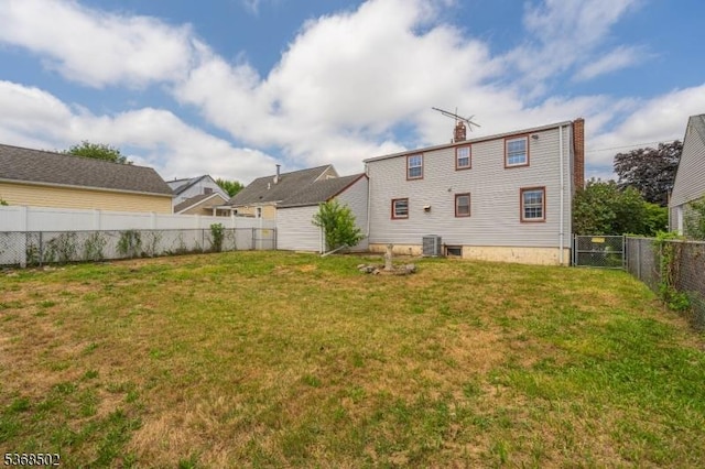 707 Erudo St, Linden City, NJ 07036 - rear view of property featuring a fenced backyard and a chimney