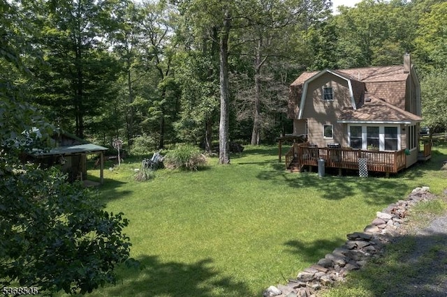115 Bierskill Rd, Montague Twp, NJ 07827 - view of grassy yard with a deck and a forest view