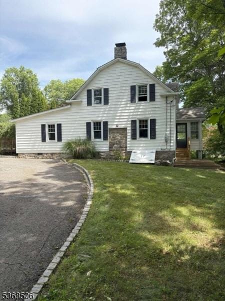 196 Littleton Rd, Morris Plains Boro, NJ 07950 - rear view of property with a chimney, a lawn, and driveway