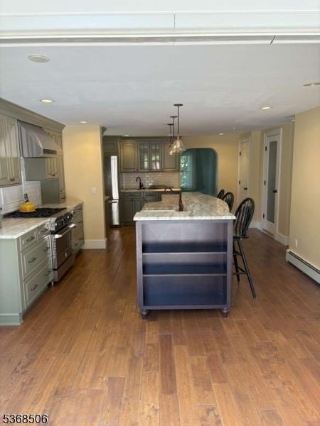 196 Littleton Rd, Morris Plains Boro, NJ 07950 - kitchen with stainless steel appliances, dark wood-style flooring, a kitchen island, glass insert cabinets, and tasteful backsplash