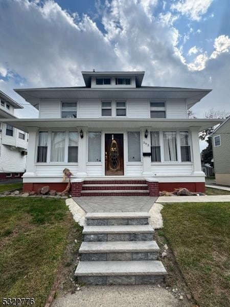 393 E 38th St, Paterson City, NJ 07504 - traditional style home featuring a front yard