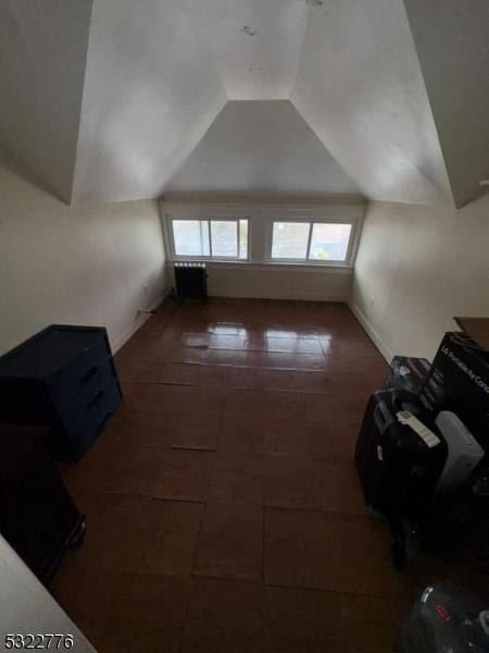 393 E 38th St, Paterson City, NJ 07504 - additional living space with tile patterned floors and lofted ceiling