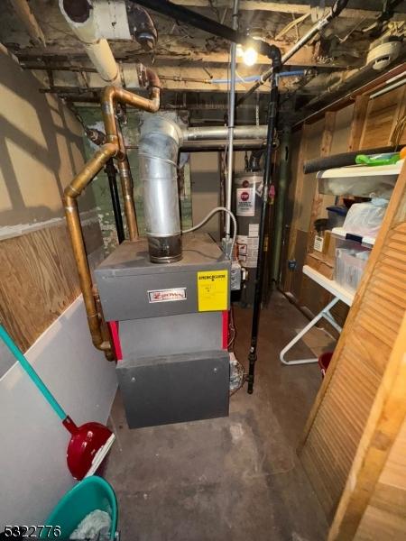 393 E 38th St, Paterson City, NJ 07504 - utility room featuring gas water heater