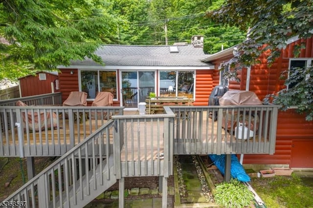 2100 Lakeside Dr, Vernon Twp, NJ 07422 - back of property featuring a deck, roof with shingles, a chimney, and stairs