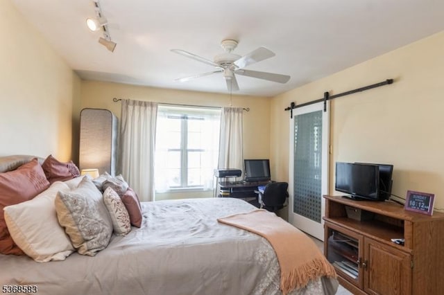 76 Avebury Pl, Franklin Twp, NJ 08873 - bedroom featuring a barn door and a ceiling fan