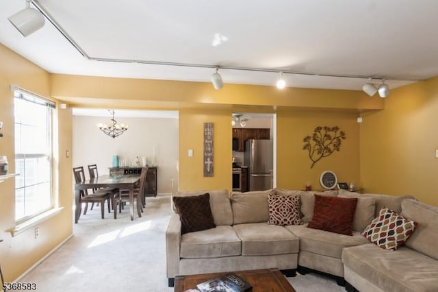76 Avebury Pl, Franklin Twp, NJ 08873 - living area with a chandelier, plenty of natural light, track lighting, and light colored carpet
