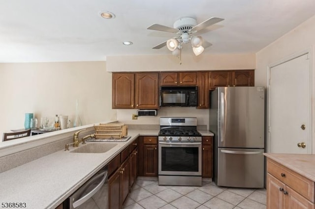 76 Avebury Pl, Franklin Twp, NJ 08873 - kitchen with stainless steel appliances, light countertops, ceiling fan, light tile patterned floors, and recessed lighting