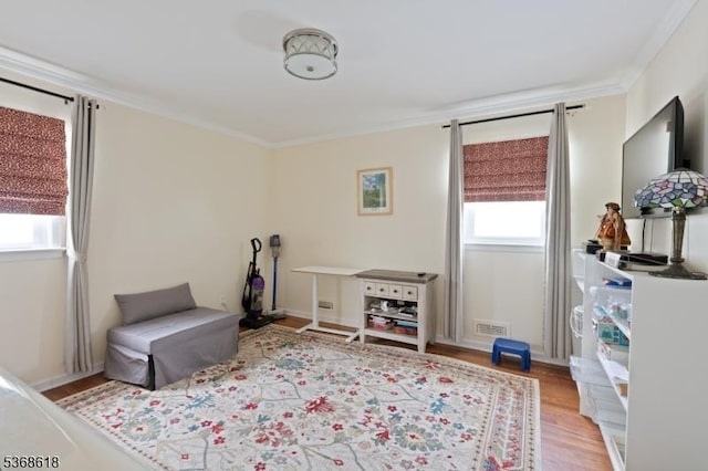 724 Bloomfield Ave, Clifton City, NJ 07012 - living area featuring plenty of natural light, light wood-type flooring, and crown molding