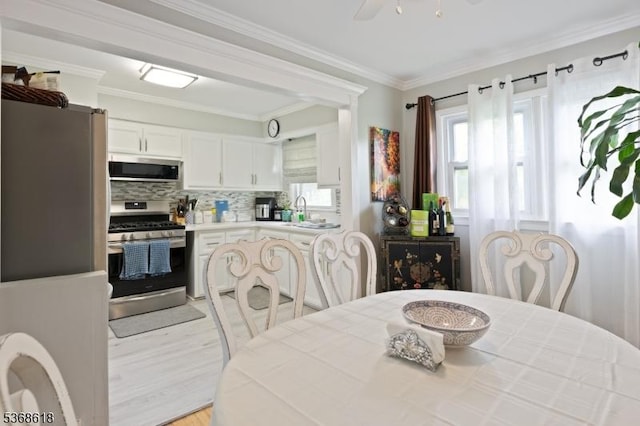 724 Bloomfield Ave, Clifton City, NJ 07012 - dining room with ornamental molding and light wood-type flooring