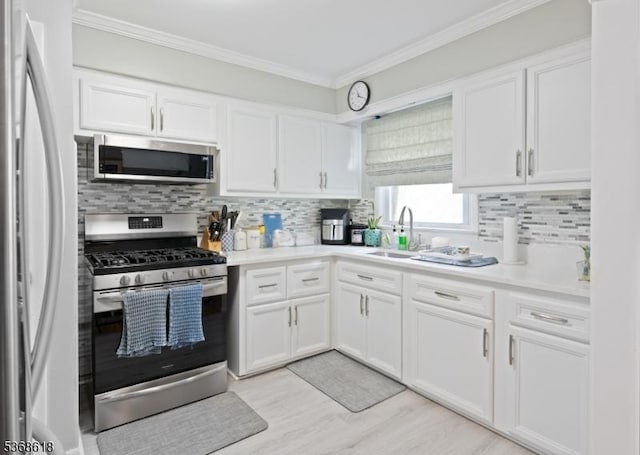 724 Bloomfield Ave, Clifton City, NJ 07012 - kitchen with stainless steel appliances, tasteful backsplash, white cabinetry, and crown molding