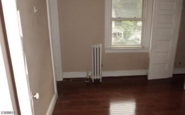 37 Benson St, Bloomfield Twp, NJ 07003 - spare room featuring radiator and dark wood-style floors