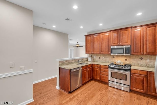 3304 Chesterwood Way, Franklin Twp, NJ 08873 - kitchen with appliances with stainless steel finishes, light wood finished floors, decorative backsplash, light stone countertops, and recessed lighting