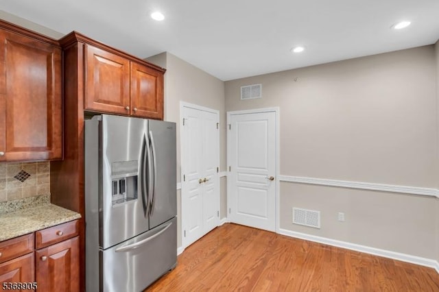 3304 Chesterwood Way, Franklin Twp, NJ 08873 - kitchen with stainless steel fridge, light wood finished floors, backsplash, light stone counters, and recessed lighting