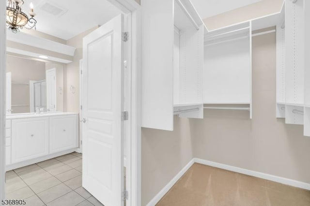 3304 Chesterwood Way, Franklin Twp, NJ 08873 - walk in closet featuring a chandelier and light tile patterned flooring